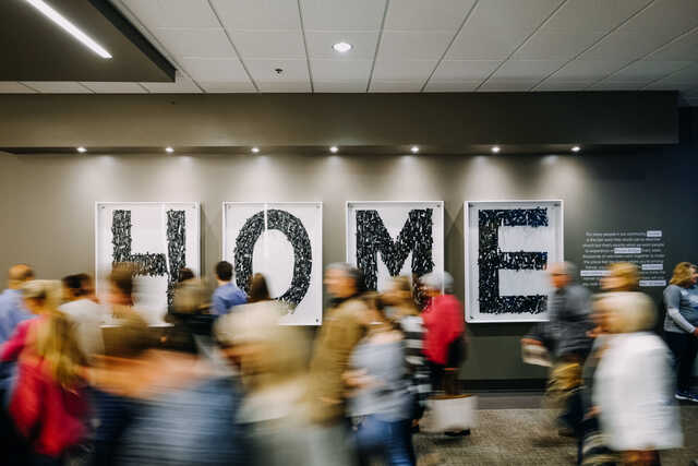 sign that says home in the hallway of browns bridge church