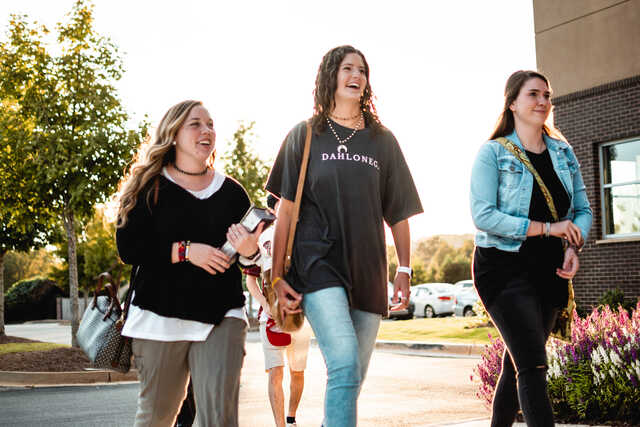 Three Young Women Walking into Browns Bridge Church for The Living Room Gathering