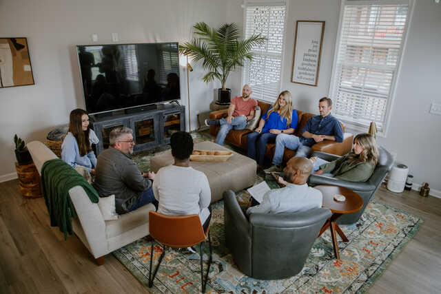 married community group in a living room