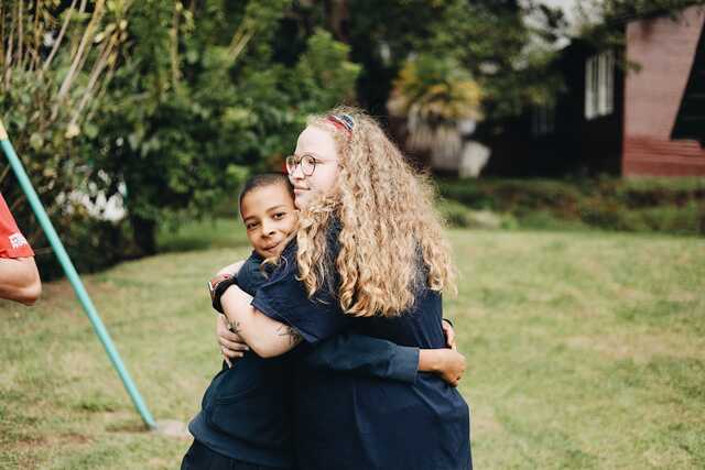 Katie Hugging Young Boy on Costa Rica Mission Trip