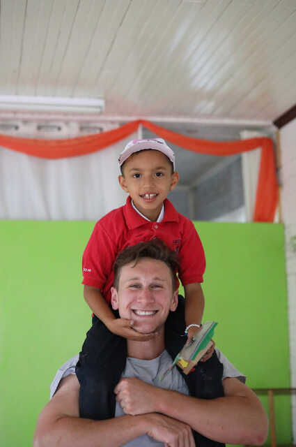 The Living Room Student, Jacob, Playing with Child on Mission Trip to Costa Rica